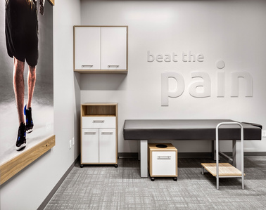 Custom furniture and fixture design and manufacturing for OrthoLazer health and wellness franchise.