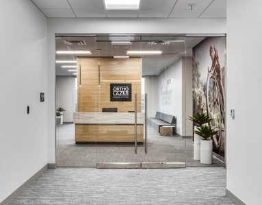 Entry way design for OrthoLazer heath and wellness franchise.