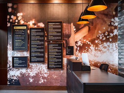 Custom wall paper print with framed menu graphics.