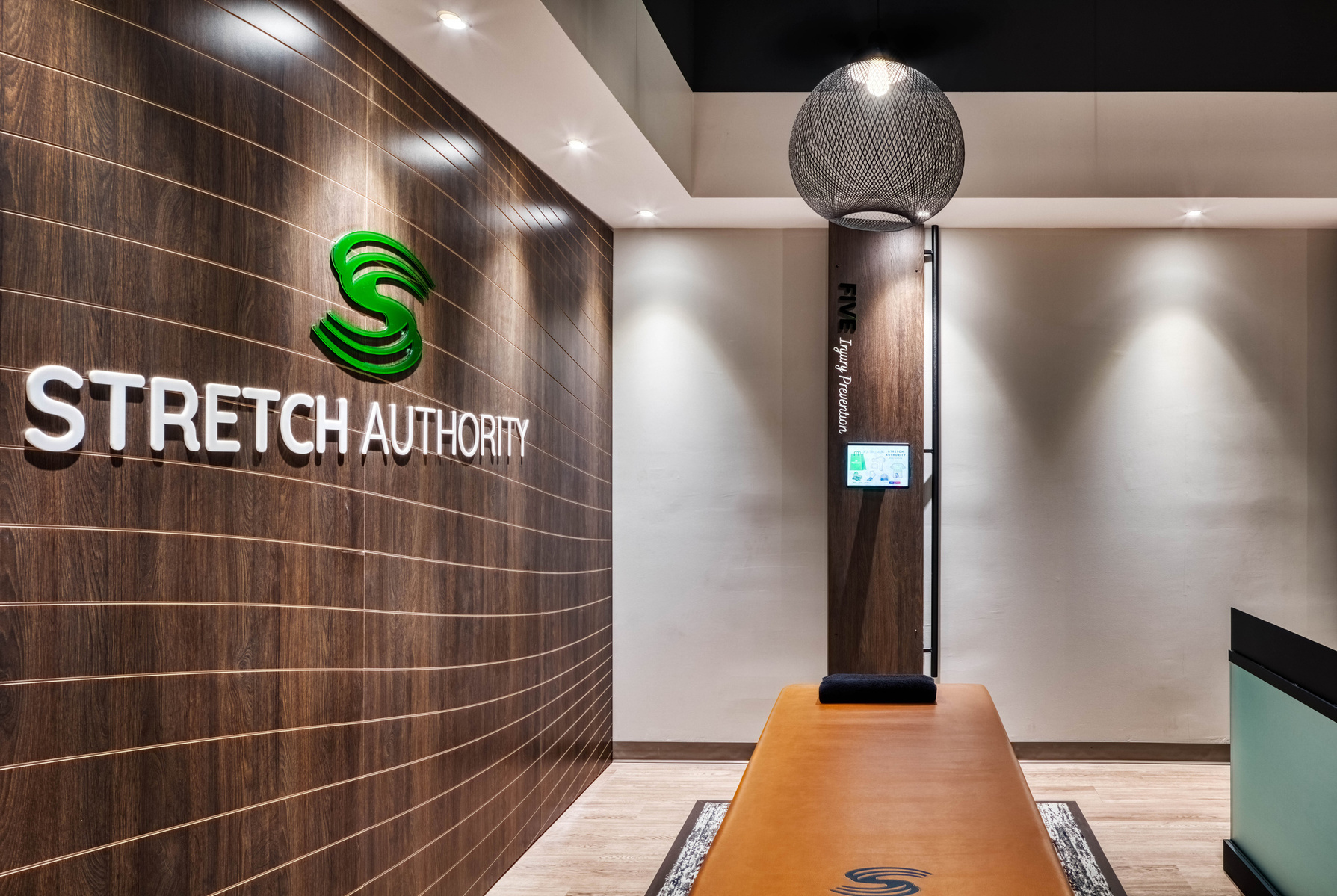 Decorative wall cladding and Stretch Authority signage