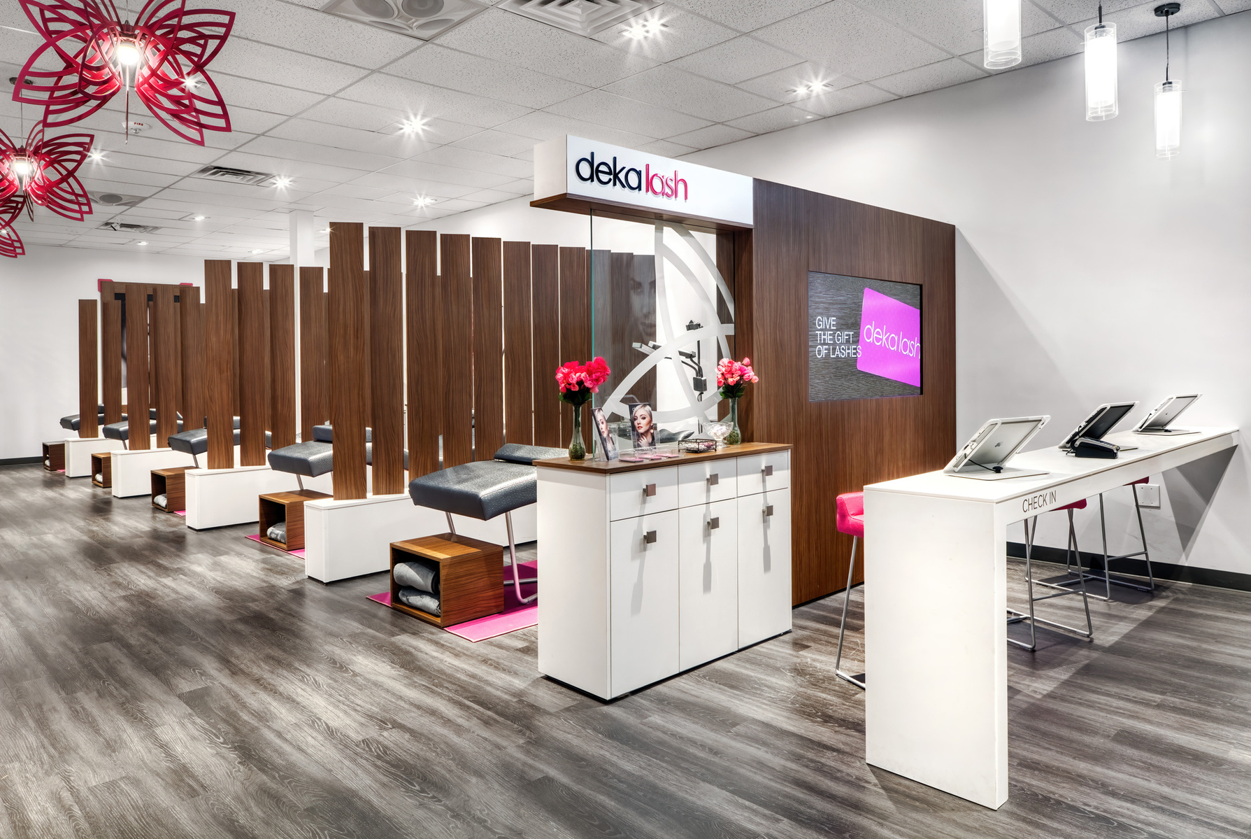 Reception area with custom branding chandeliers and check-in counter