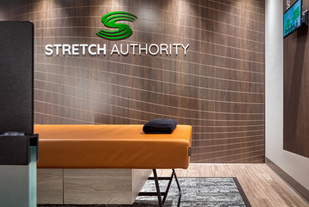 Stretch bed detail and custom wood grain wall panels