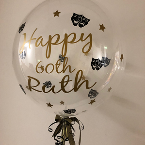 A personalised clear music themed balloon display for birthdays.