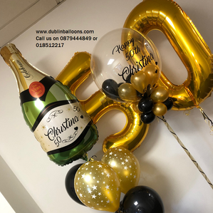 A champagne balloon, large balloon numbers and a large personalised balloon for birthdays.