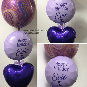 A Purple balloon selection with a personalised foil balloon in heart and round shapes.