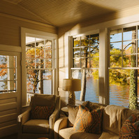 Evening light streams in through windows in a conservatory