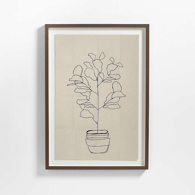 Potted fern fiddle leaf ink drawing reproduced on deckle paper with a white mat and wood frame by Crate and Barrel.