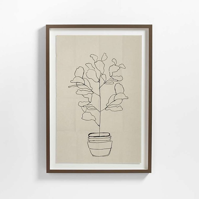 Potted fern fiddle leaf ink drawing reproduced on deckle paper with a white mat and wood frame by Crate and Barrel.