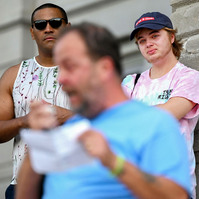 Jay, right, cries while listening to his dad, Harry Castilow, front, speak through tears about his experience raising a transgender child during a Keep Hate Out of Healthcare protest at Jesse Hall.
