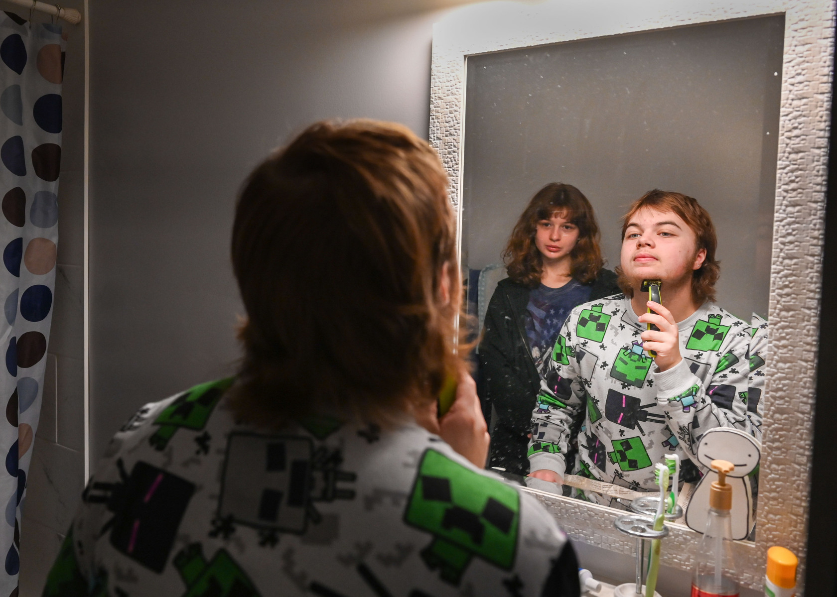 Jay shaves for the first time since he began medically transitioning as his then-girlfriend watches in his bathroom.