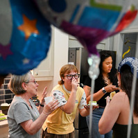 Jay celebrates his high school graduation with friends and family on at his home.