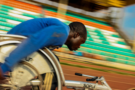 A wheelchair race athlete during his training on the track. Paralympic Sports Wheelchair Race Powerlifting