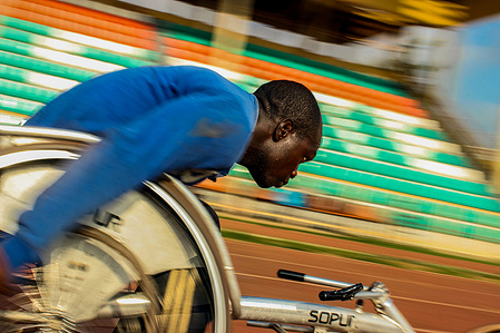 A wheelchair race athlete during his training on the track. Paralympic Sports Wheelchair Race Powerlifting