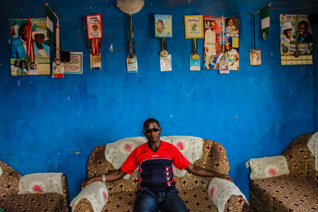 A blind athlete and two times paralympian sitting in his living room.  Paralympic Sports Blind Athlete