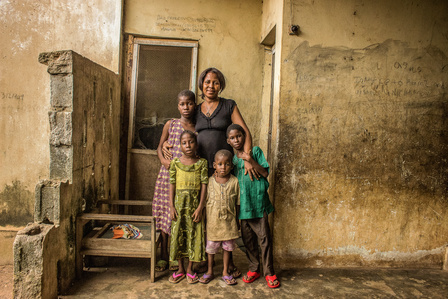 Aminatu, a Sierra Leonean refugee and her children in front of their room at the Oru international refugee camp, Nigeria.  Liberian Passport Liberia Refugee Civil War 