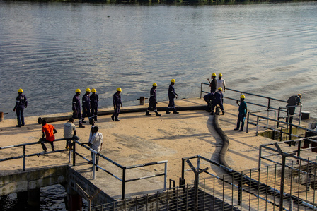 Technical staff of the depot preparing equipments needed to to offload products from the vessel. Oil and gas