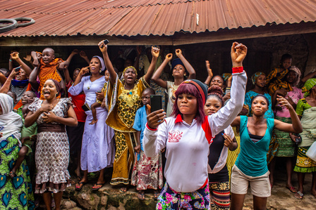 Spectators cheer the Osun votary maid (Arugba) on the way to the Oaun river for rituals during the grand finale of the celebration of the annual Osun-Oshogbo festival. Festival Culture Tradition