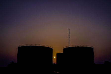 Petroleum products tanks inside the depot at sunset. Oil and Gas