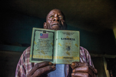Gadafi holding his old Liberian Passport.
Liberia Refugee Civil war