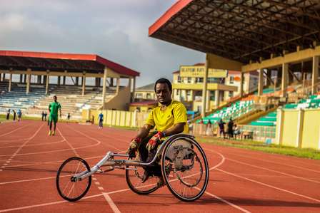 A wheelchair race athlete during his training on the track. Paralympic Sports Wheelchair Race Powerlifting