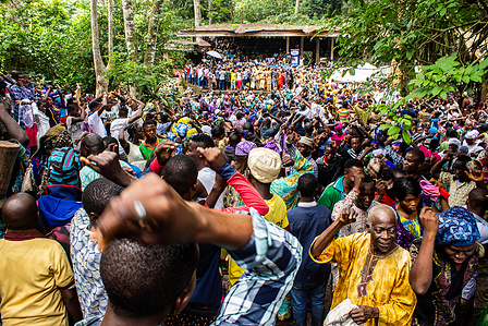 Osun worshippers, spectators and tourists react to prayer at the Ojubo Osun during the grand finale of the celebration of the annual Osun-Oshogbo festival. Festival Culture Tradition