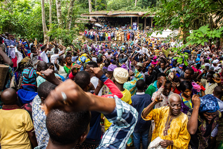 Osun worshippers, spectators and tourists react to prayer at the Ojubo Osun during the grand finale of the celebration of the annual Osun-Oshogbo festival. Festival Culture Tradition
