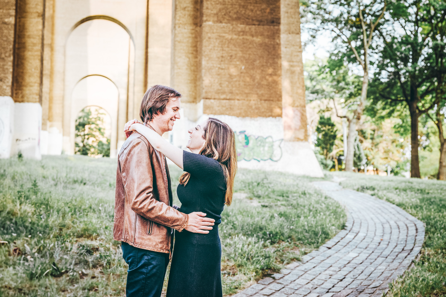 Astoria park engagement session, smiles and beautiful light, leading lines, embracing. mc3 photo documentary engagement photographer 