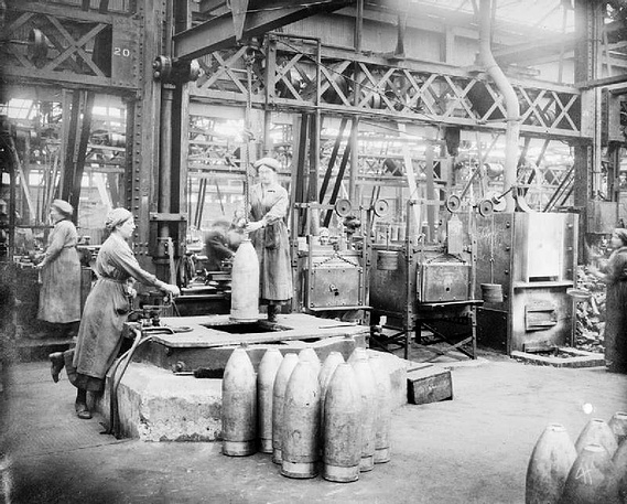 Female munitions workers (nicknamed 'munitionettes') manufacturing heavy artillery shells at one of the Vickers Limited factories.
