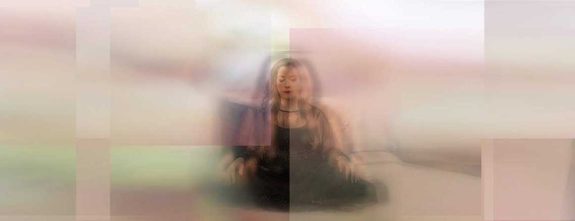 Image of a woman meditating with beautiful colors