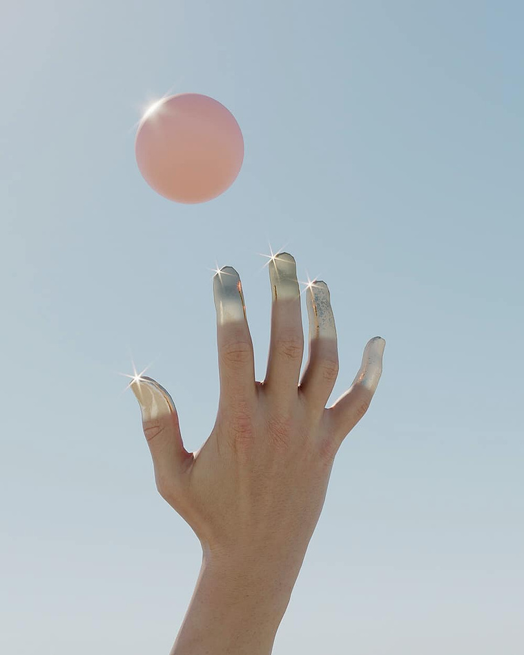Pink ball and hands dipped in silver paint in the sun by David Stenbeck for Beyond Photography CGI 