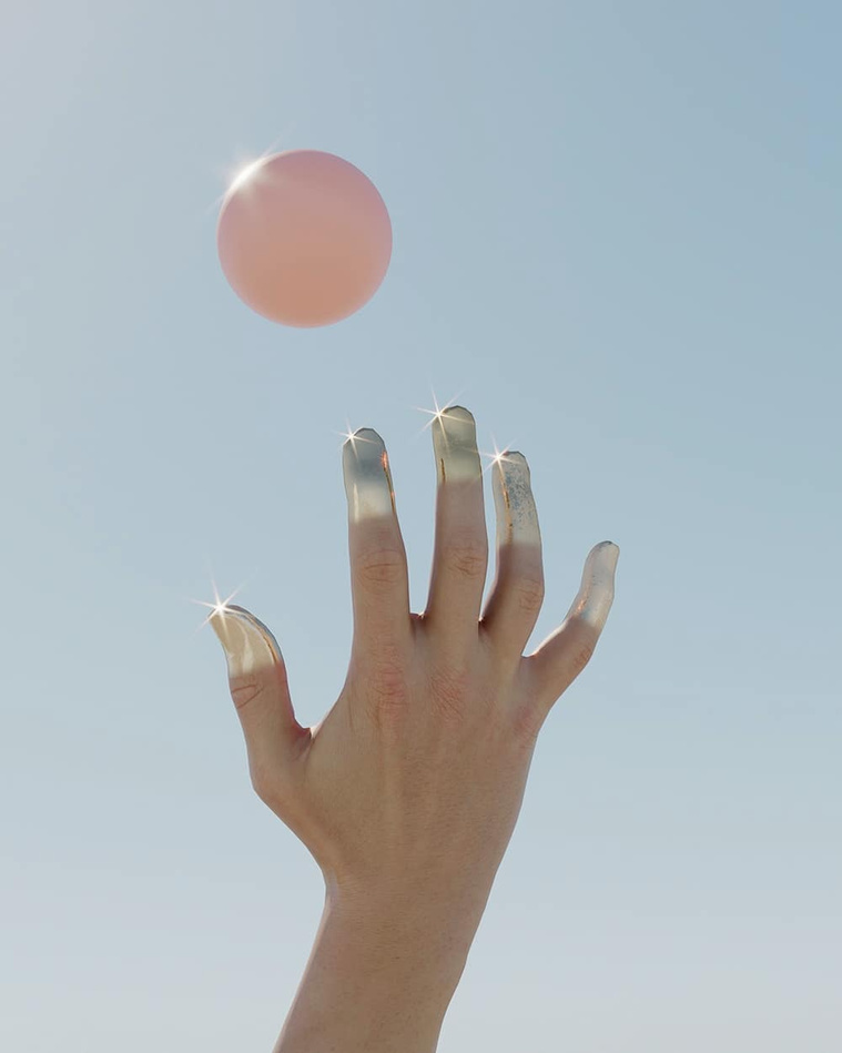 Pink ball and hands dipped in silver paint in the sun by David Stenbeck for Beyond Photography CGI 