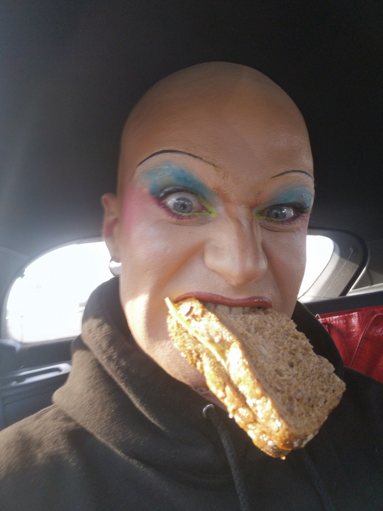 Beyond Photography London and Amsterdam based creative production agency. Image of Chelseaboy eating a sandwich from the UTOPIA exhibition at NDSM Fuse in collaboration with Amsterdam Pride