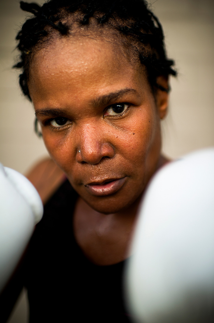 Denise Shane-Cheaney, 51, of Evansville, while training at Rock'em Sock'em Boxing & Kickboxing in Evansville, Thursday, August 4, 2016. Shane-Cheaney has lived with essential or hereditary tremors in her arms and hands since
