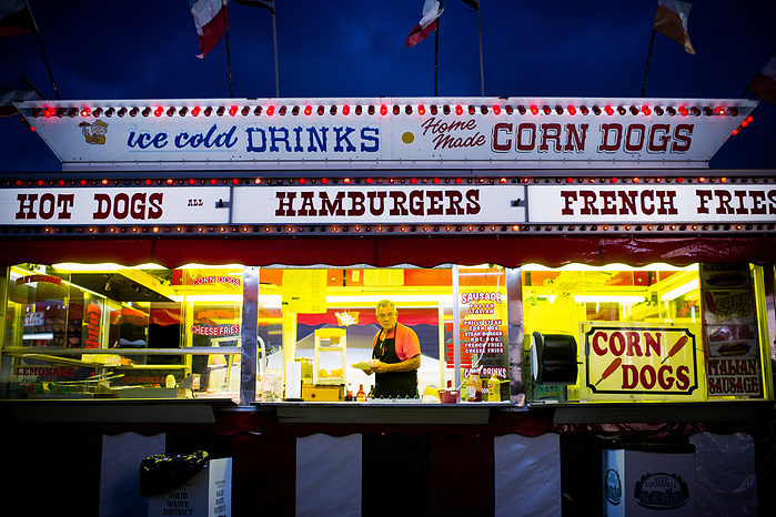 John Marconi, of Suwannee, Fl., waits for a customer to pick up an order during the 2016 Vanderburgh County Fair in Evansville, Thursday, July 28, 2016.