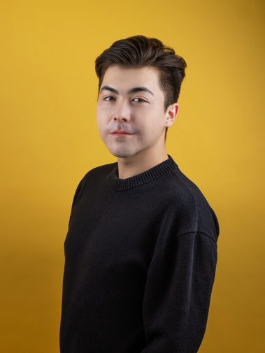 Studio photography headshot of a man with a colorful background. Photographed by chicago headshot photographer gloria cristina