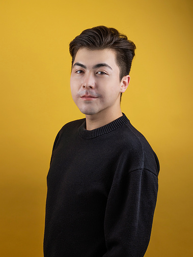 Studio photography headshot of a man with a colorful background. Photographed by chicago headshot photographer gloria cristina