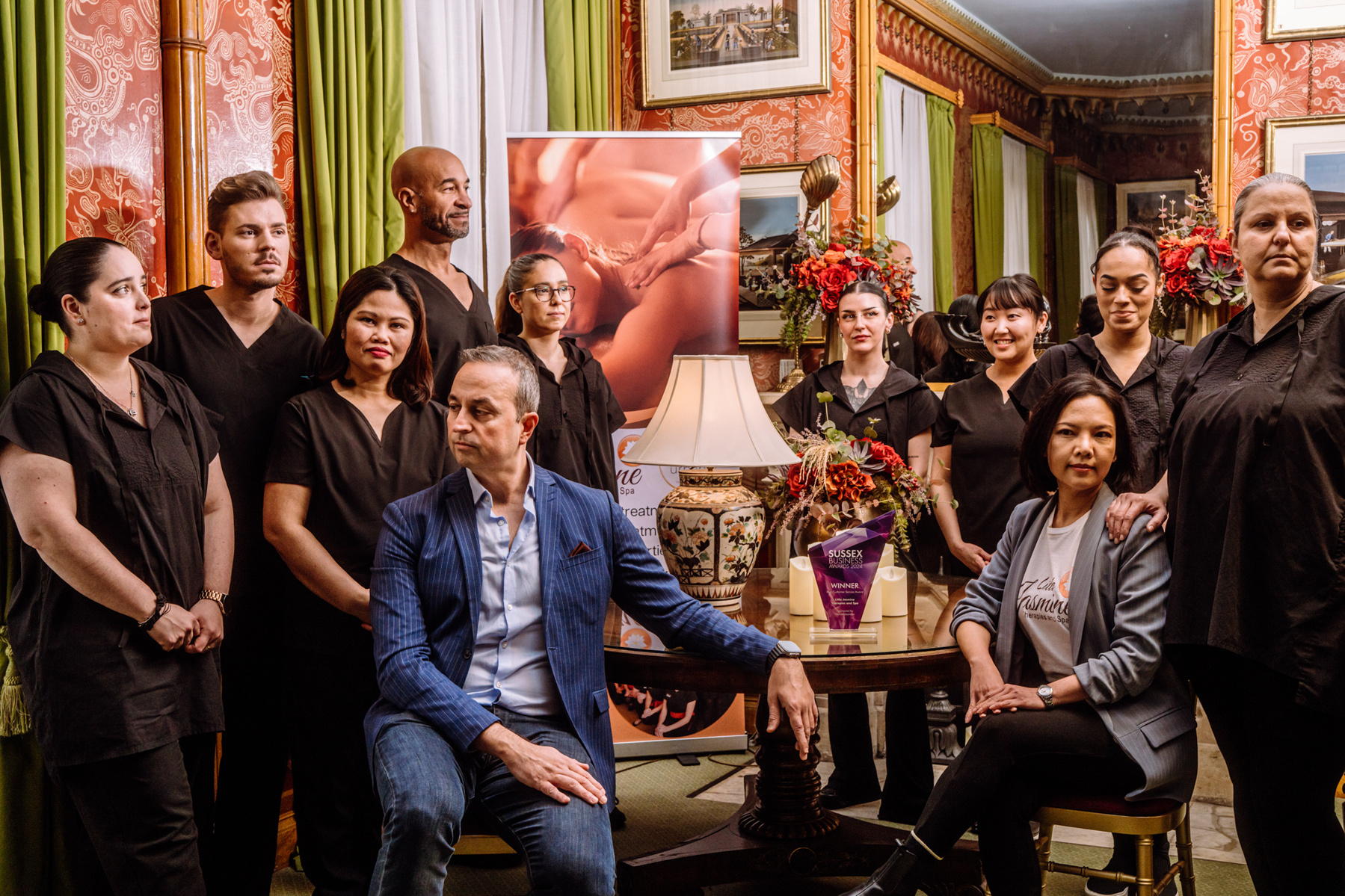 The team at Little Jasmine Spa in Brighton posing at the Red Room inside the Brighton Pavilion.
