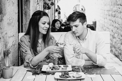 A young couple sharing lunch at Cafe Festival in Dubrovnik.
