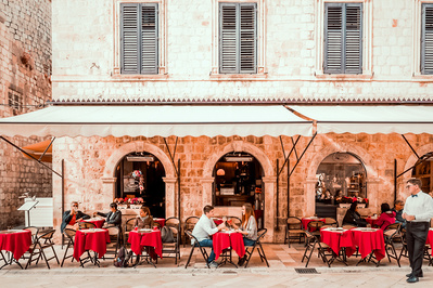 The stunning terrace of Cafe Festival during lunch time inside Dubrovnik's old town walls.