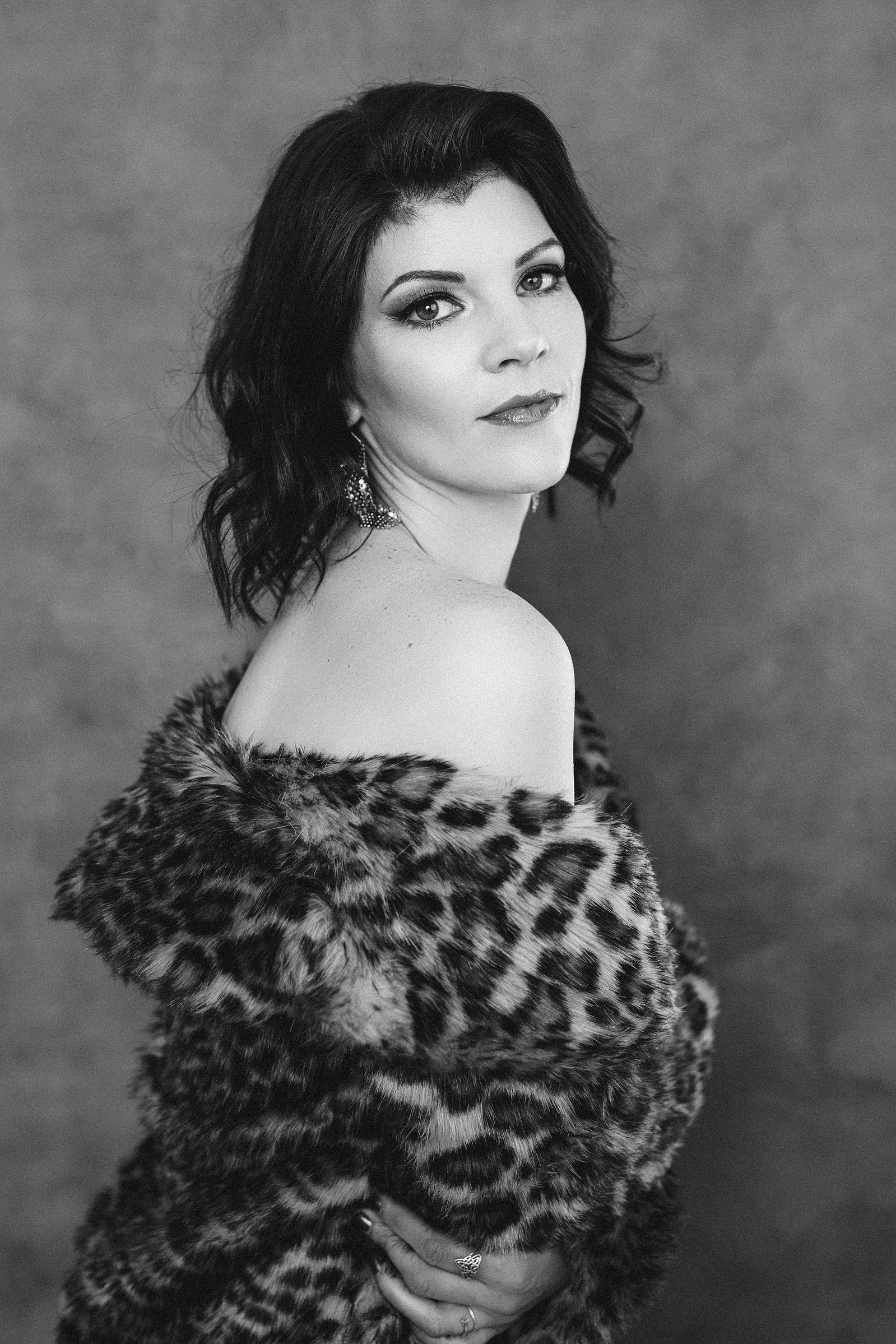 A glamourous brunette poses for a photo, she could pass for an old hollywood movie star