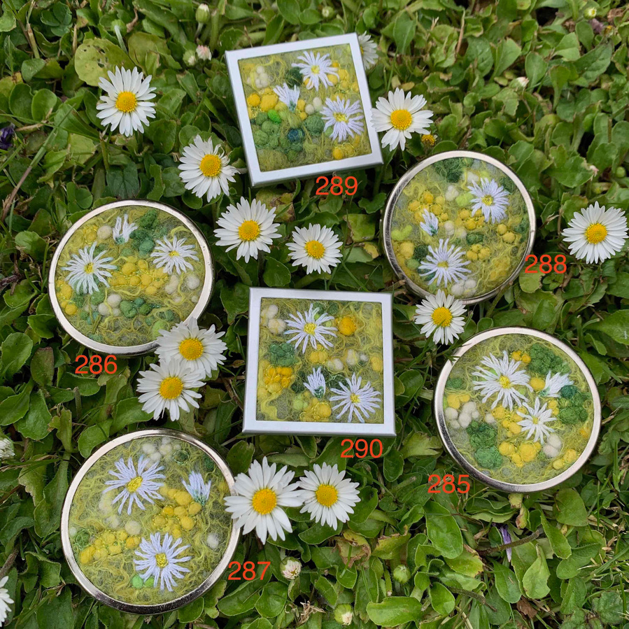 Wearable art badges by Lynn Comley Buttercups and Daisy brooches. Designer original wearable textile art. Embroidered and wet felted little bundles of happiness
