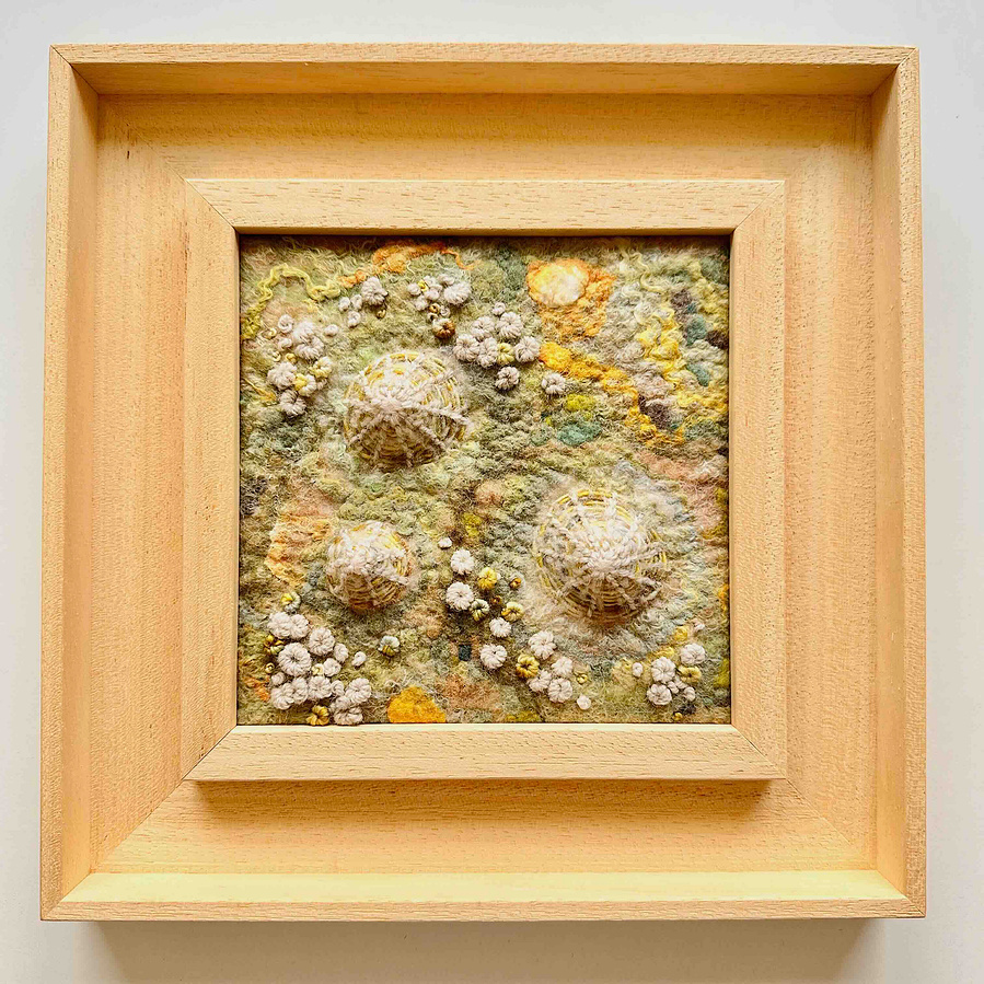 artwork inspiredly the ocean. Limpet shell study made entirely from wool and silk with hand embroidery. By Lynn Comley a British textile artist. 