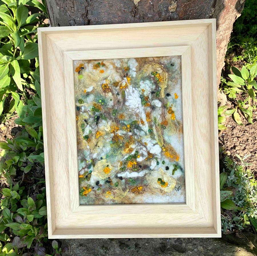 lichens on an ash tree wet felted textural work by Lynn Comley British Feltmaker known as Up and down dale, Yorkshire artist inspired by the natural world. `framed in a bare wood St Ives frame