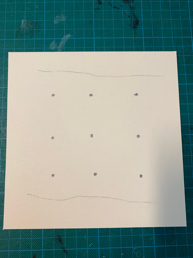 The pencil marks showing where the holes will be made 