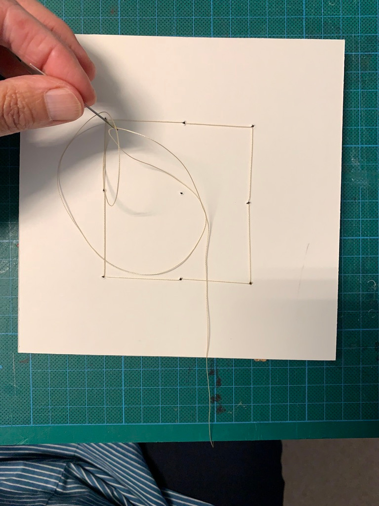How to string a wet felted textile artwork onto a conservation mount board in preparation for framing
