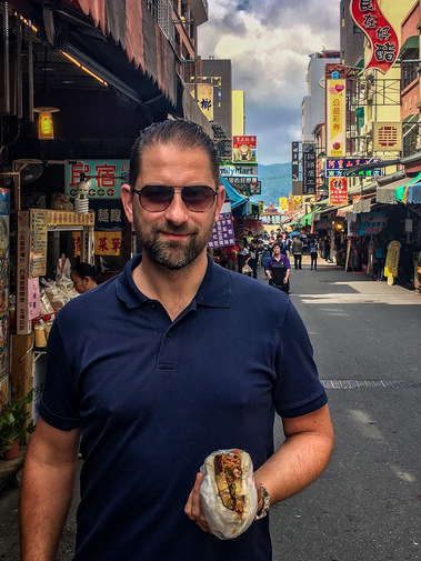 Benn Glazier with Taiwanese street food in on streets near to Sun Moon Lake.
