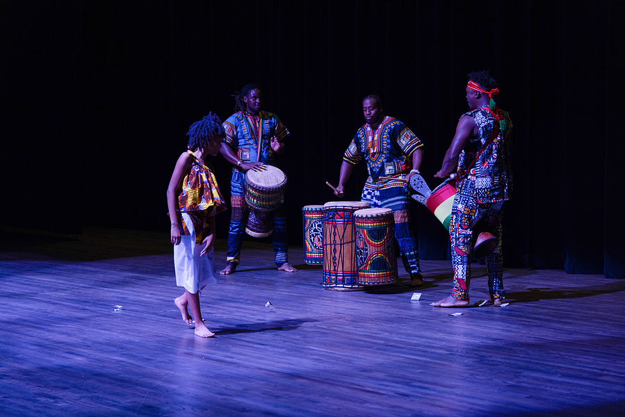 Previous performer, an energetic and agile dancer, drops a dollar bill for the drummers at the Inaugural Afro-Rhythm Dance & Wellness Conference at the Savannah Cultural Arts Center, October 2024
