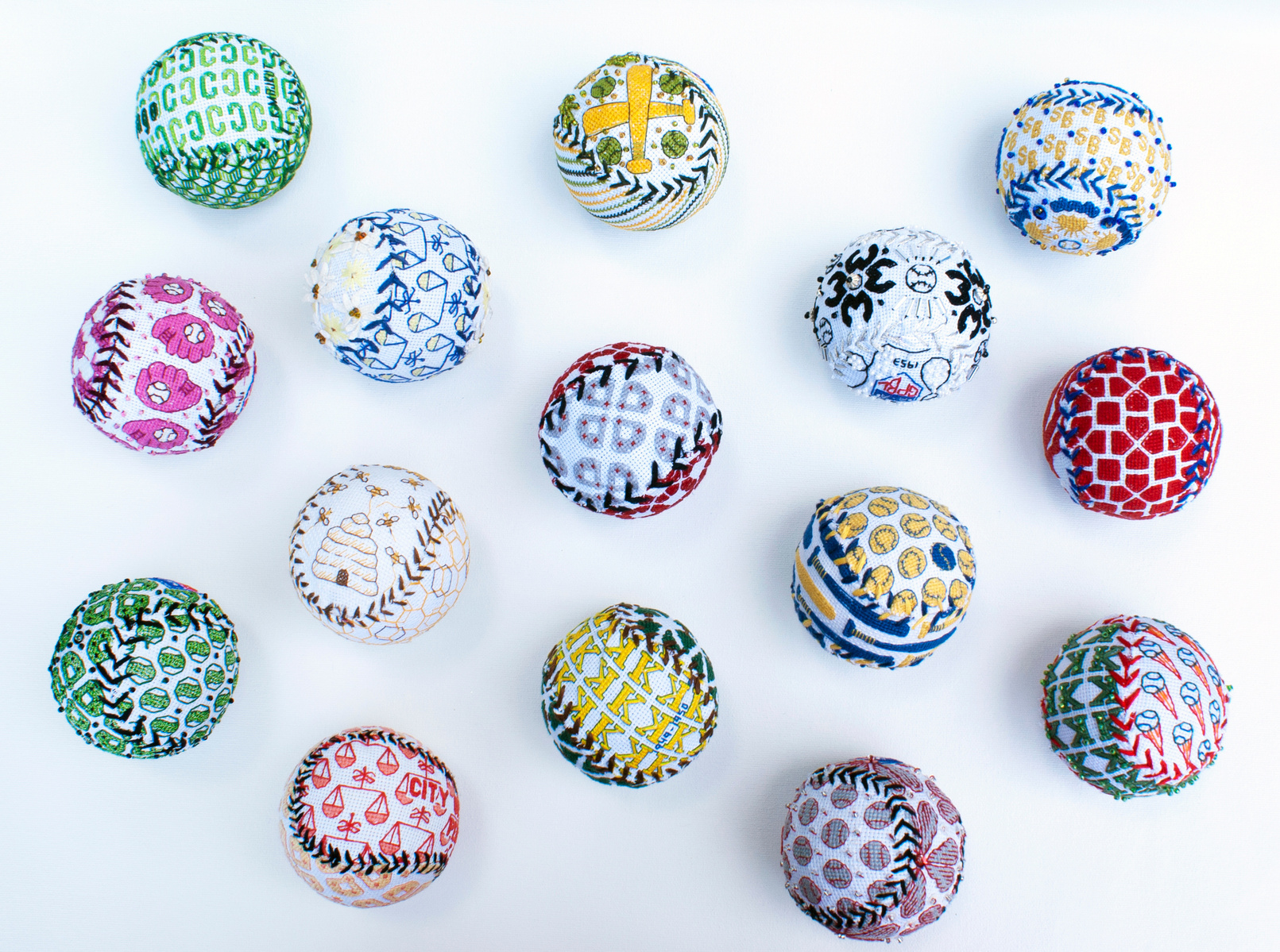 15 Cotton Embroidered Baseballs representing the forgotten teams of the All-American Girls Professional Baseball League