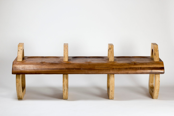 Due to nearly constant use, public seating must be sturdy, therefore, 32 tenons from the legs and arm rests connect with the mortises of the 2 inch thick bench. 