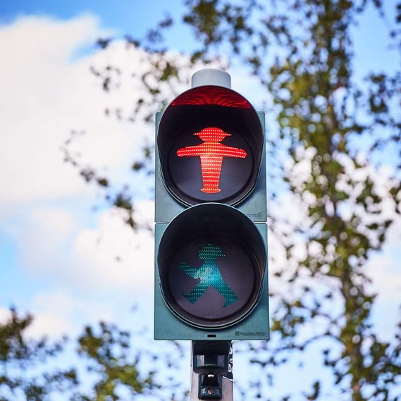 Ampelmann, Germanys unique road crossing icon in red can be seen on a traffic light.